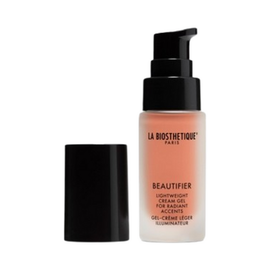 Iluminador Beautifier de La Biosthetique con dosificador abierto, ideal para aplicar brillo dorado rosa en rostro, cuello y cuerpo.