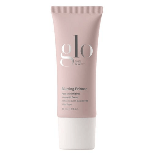 Glo Skin Beauty Blurring Primer in a soft pink tube, designed to minimize pores, smooth texture, and extend makeup wear for all skin types.