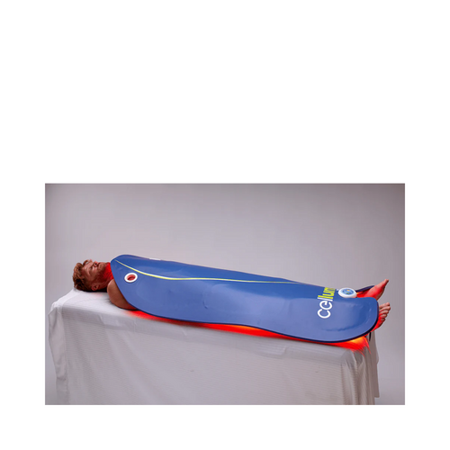 Celluma Delux XL LED therapy device in use on a treatment table, delivering full-body anti-aging and wellness benefits.