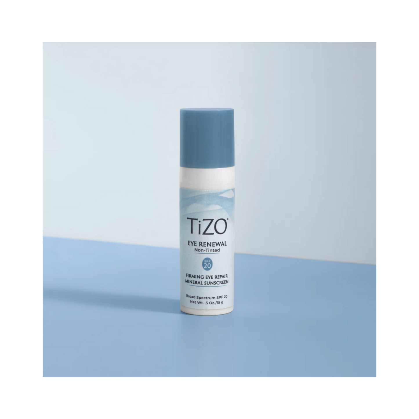 TiZO Eye Renewal SPF 20 eye cream displayed on a blue surface, highlighting its elegant packaging and skin care benefits for the eye area.