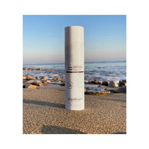 Algologie Hydra Ecume - Double Exfoliation Foaming Powder on beach shore, highlighting its detox and clean skincare benefits for the face.