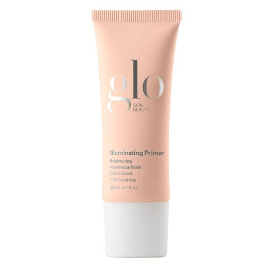Glo Skin Beauty Illuminating Makeup Primer in a peach tube, designed to brighten and color-correct for radiant, glowing skin.