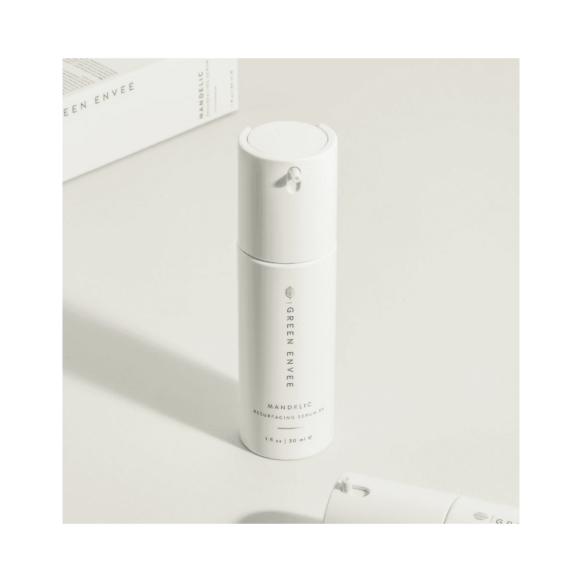 Minimalist display of Green Envee Mandelic Resurfacing Serum 8% bottle, targeting acne, skin firmness, and texture improvement.