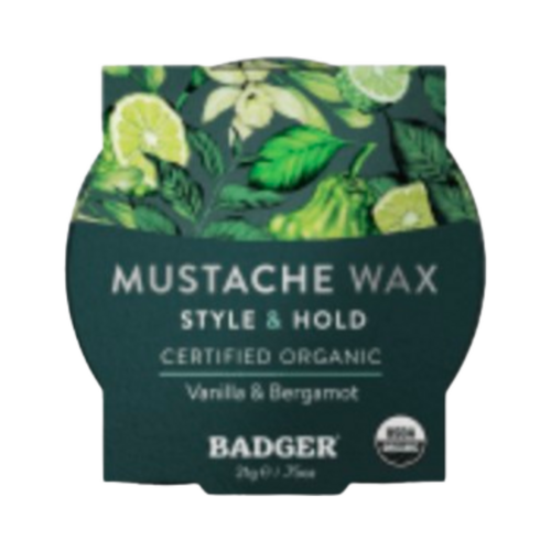 Badger Balms のナリシング マスタッシュ ワックスは、バニラとベルガモットを配合したオーガニック グルーミング製品で、男性のフェイシャル ケアのスタイルと保持力を考慮して設計されています。
