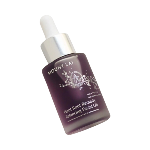 Elegante frasco de óleo facial balanceador Mount Lai inclinado para mostrar o rótulo e o soro roxo, perfeito para brilho natural e equilíbrio da pele.