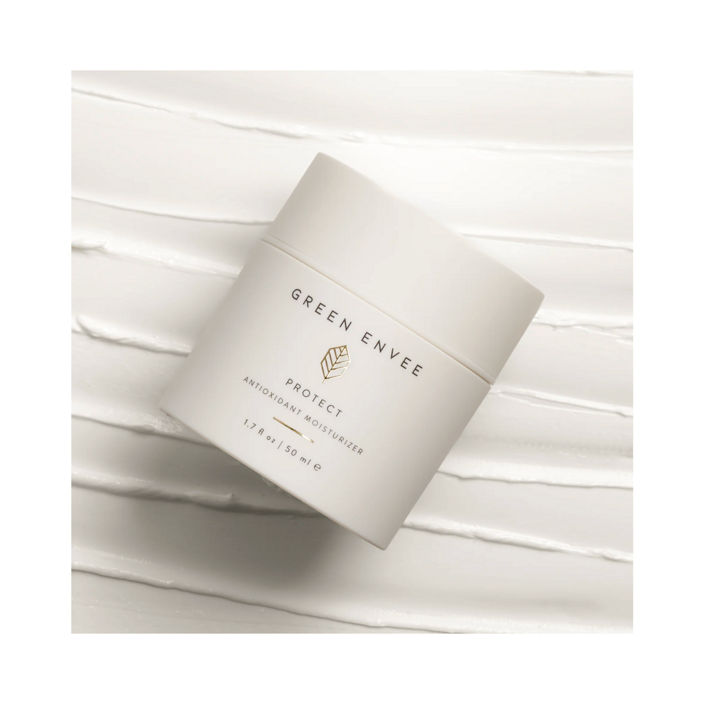 Green Envee Protect Moisturizer jar on creamy background. Antioxidant-rich face cream for daily hydration and environmental defense.