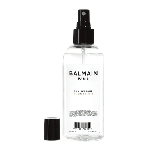 BALMAIN Hair Silk Perfume 200ml with cap off, ideal for detangling and heat protection. Enhances shine and nourishes damaged hair.