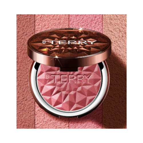 By Terry Tea To Tan Coral Crush blush compact with geometric design, set against a coral-toned background for visual appeal.