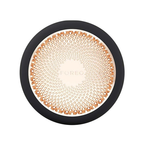 Foreo UFO 3 בצבע שחור אלגנטי המיועד לטיפולי ספא לפנים. מכשיר לטיפוח העור אנטי אייג'ינג עם אור לד וטיפול NIR להקלה על עור יבש.
