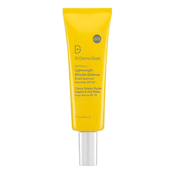Dr Dennis Gross SPF 30 Sunscreen in yellow tube with silver cap, labeled as all-physical, oil-free wrinkle defense for daily sun protection.