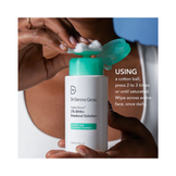 Demonstration of how to use Dr Dennis Gross Breakout Solution with cotton ball for daily acne treatment routine.