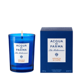 Acqua Di Parma Arancia Di Capri Candle lit beside its elegant blue packaging, offering relaxing citrus notes for a serene ambiance.