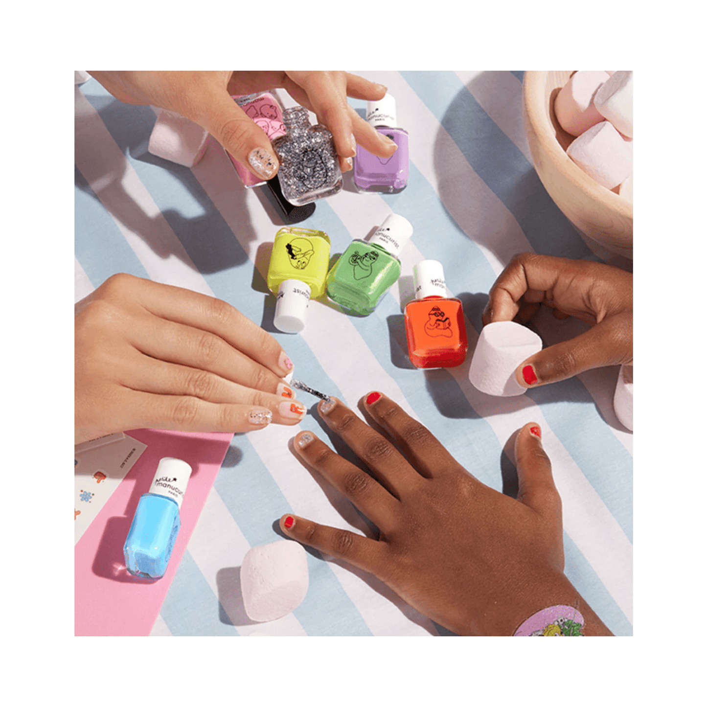 Children's hands painted with red and glitter Barbapapa Nail Polish - Kids Nail Polish by Manucurist, ideal for playful nail art.