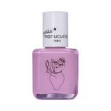 Child holding glass with rainbow-painted nails using Barbapapa Nail Polish - Kids Nail Polish by Manucurist, playful and expressive.