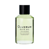 Close-up of Olverum Bath Oil bottle with green-tinted liquid. A rejuvenating body oil made with natural essential oils.
