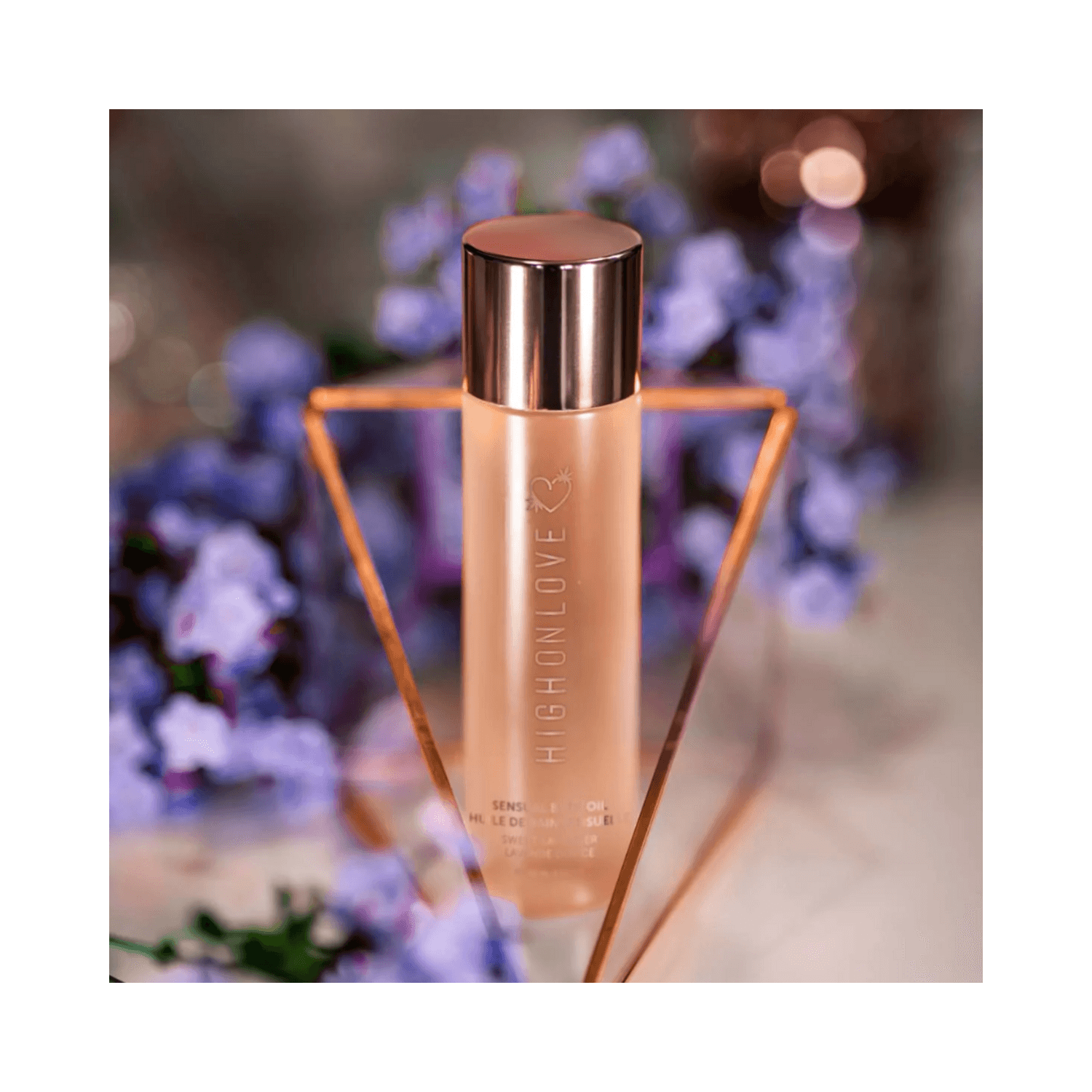 High on Love Sweet Lavender Body Oil displayed with lavender flowers, highlighting its soothing scent and premium packaging.