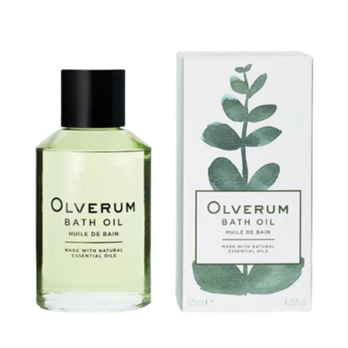Olverum Bath Oil 125ml bottle next to its packaging box with botanical design. A luxurious body oil for calming bath rituals.