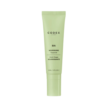 Codex Bia Facial Oil 30ml in a sleek green tube, ideal for dry skin. Lightweight face oil designed to moisturize and restore skin balance.