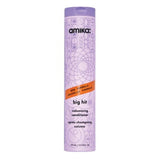 Amika Big Hit Volumizing Conditioner in a tall lavender bottle with geometric design, ideal for adding weightless moisture and volume to limp hair.
