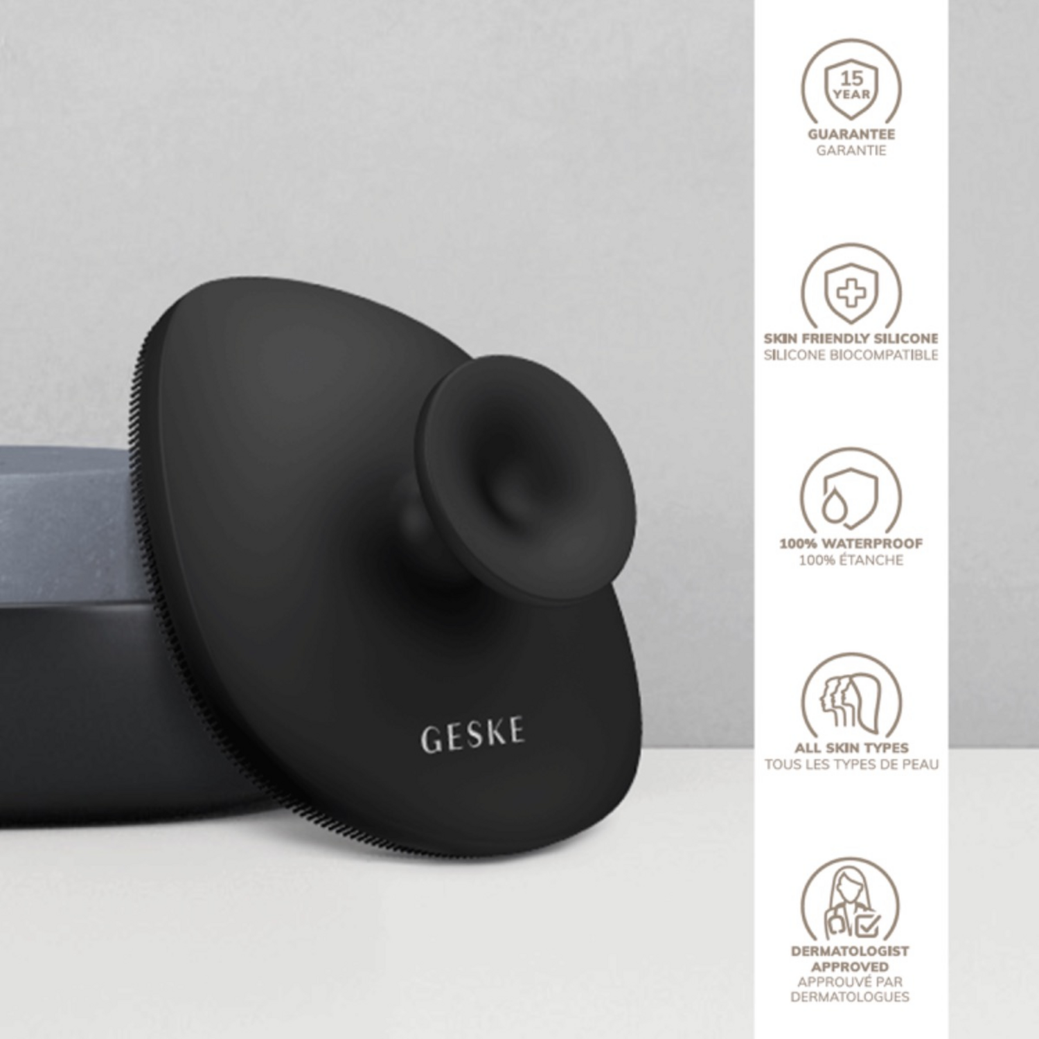 Black Geske Body Brush 4 in 1 shown with feature icons including waterproof design, biocompatible silicone, and 15-year guarantee.