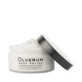 Olverum Body Polish jar held in hand against a white background. A luxurious exfoliating treatment for smooth, radiant skin.
