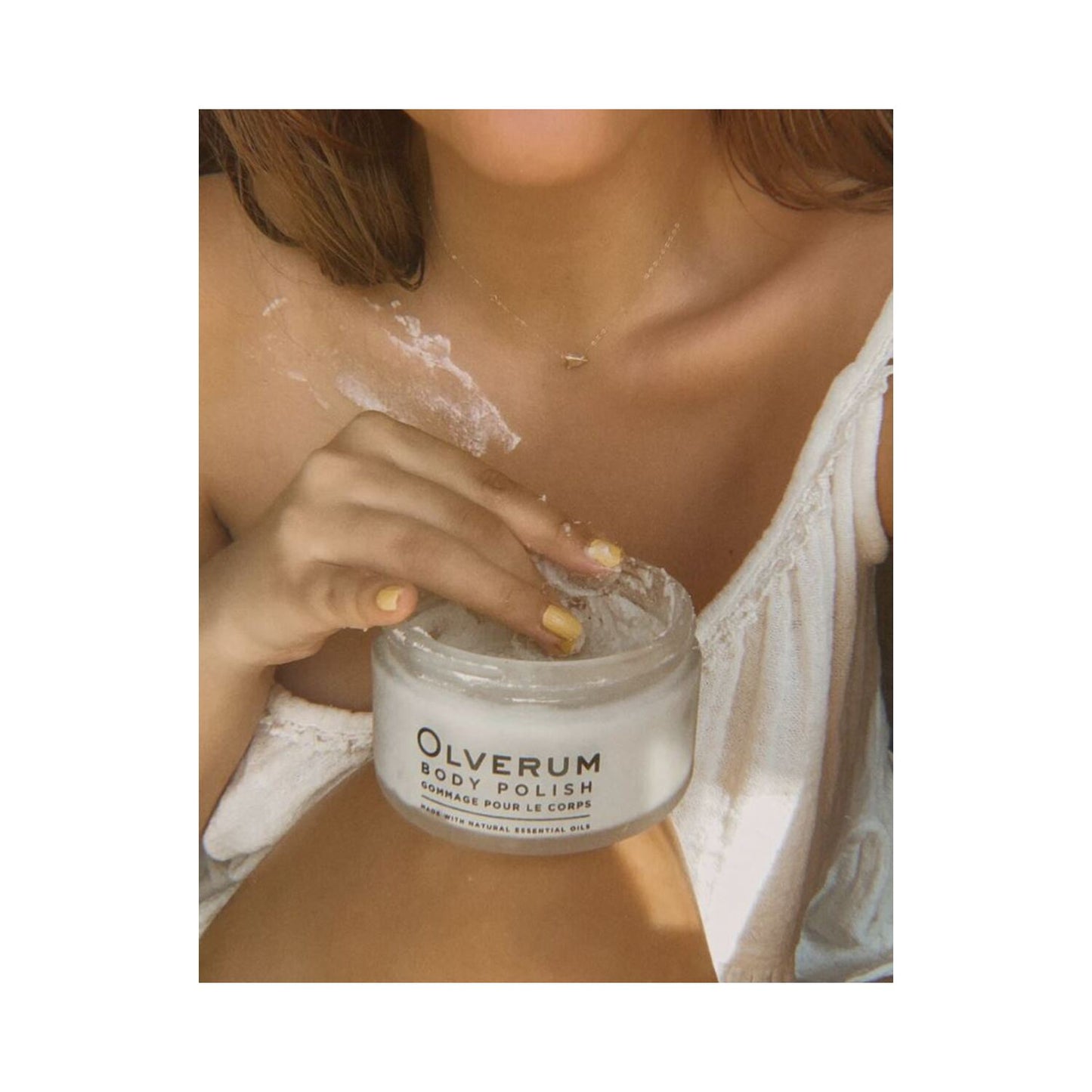 Olverum Body Polish in sleek silver tube, 50ml size. Compact exfoliating skincare solution made with essential oils for travel or daily use.