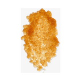Close-up of brown sugar crystals from the Brown Sugar Body Polish Exfoliator, showcasing natural exfoliating texture for radiant skin.