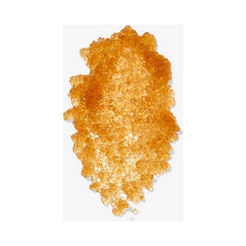 Close-up of brown sugar crystals from the Brown Sugar Body Polish Exfoliator, showcasing natural exfoliating texture for radiant skin.