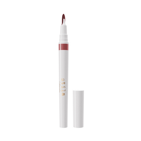 Stila Calligraphy Lip Stain in light peach tone with precision brush tip. Ideal for soft lip contouring and color layering.