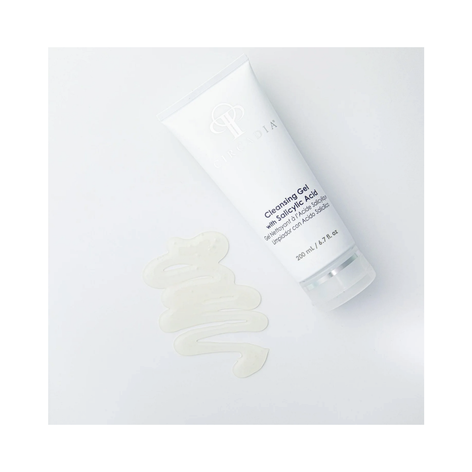 Buy Circadia Cleansing Gel with Salicylic Acid - eSkinStore.com. Gel texture shown beside 200ml tube, highlighting creamy foam formula with exfoliating salicylic acid.