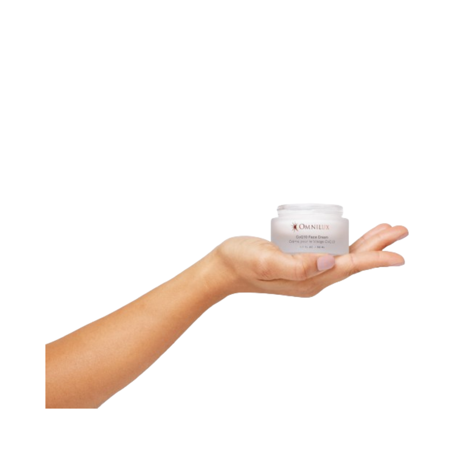 Omnilux CoQ10 Face Cream displayed on an open palm, highlighting the compact 50ml jar ideal for daily skincare.