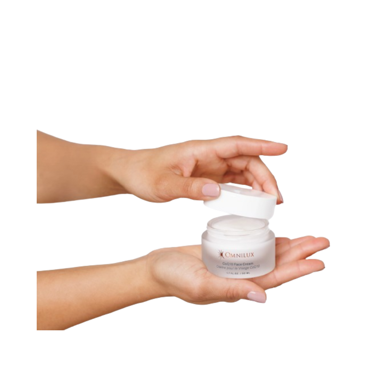 Hands opening Omnilux CoQ10 Face Cream jar, showcasing product ready for application to face and neck areas.
