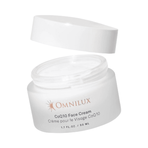 Omnilux CoQ10 Face Cream jar with lid off, revealing product inside for LED therapy-enhanced skincare routines.