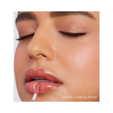 Jane Iredale Colorluxe Lip Glaze in Siren, a classic red gloss with a beige cap, perfect for a bold, glossy lip statement.