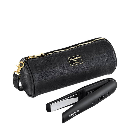 Sladdlös BALMAIN Paris Hair Couture Titanium Straightener visas med ett lyxigt svart fodral med dragkedja, perfekt för resor och backstage hårstyling.