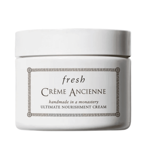 Fresh Creme Ancienne restorative face cream in a white jar, designed to nourish and smooth fine lines for delicate skin care.