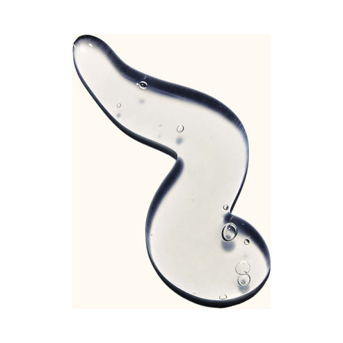 Person dispensing Amika Curl Corps Enhancing Gel into hand, demonstrating easy application for weather-proof curl styling.