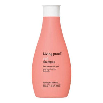 Living Proof Curl Shampoo in a coral pink 12 oz bottle, designed for curly hair care with gentle, sulfate-free cleansing.