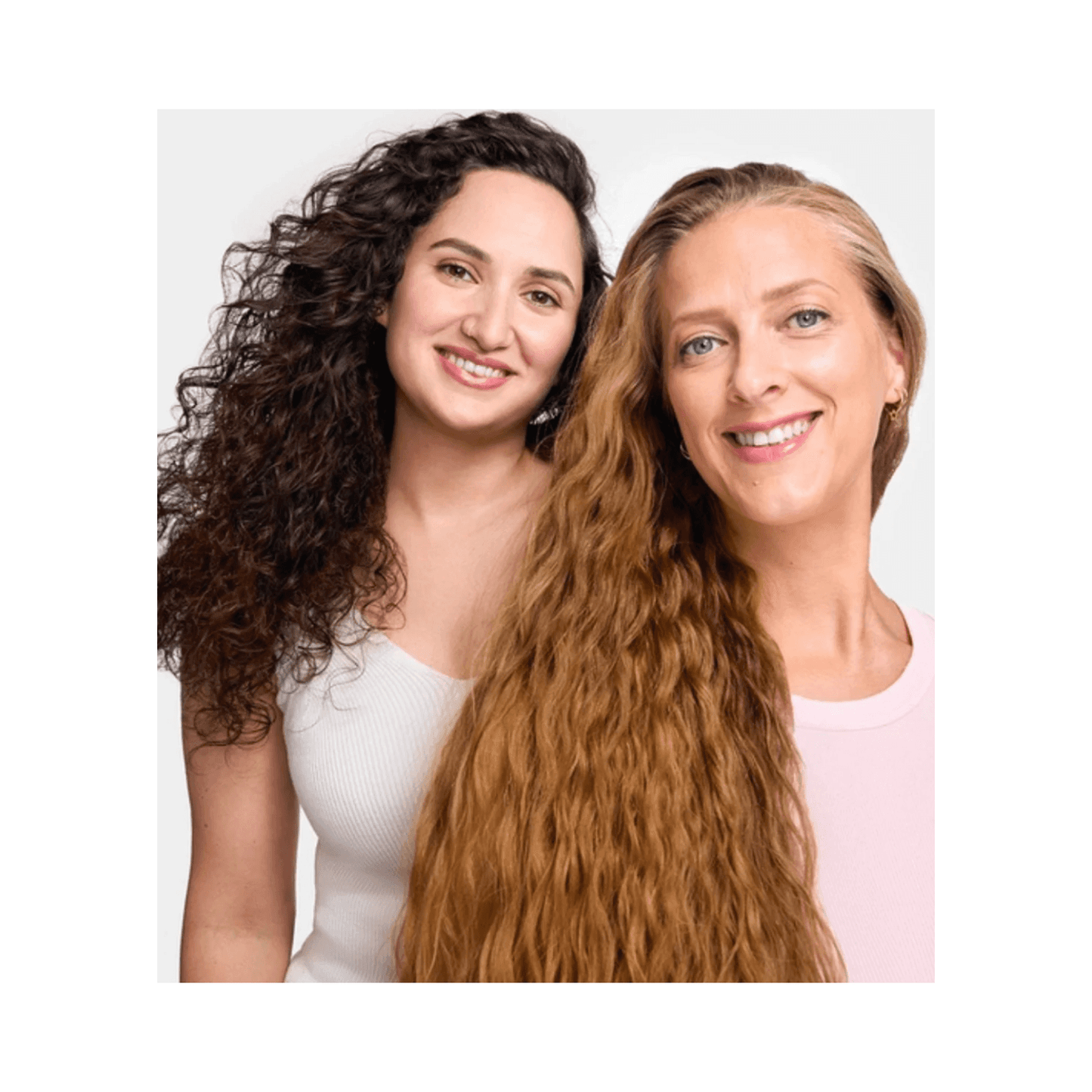 Two women with defined curly and wavy hair showcasing results of Phyto Curls Hydration Shampoo - Best Phyto Curls Shampoo for soft, hydrated curls.