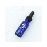 Circadia Cyto-comm Serum 0.5 fl oz dropper bottle on a white background with water droplets, ideal for mature skin care.