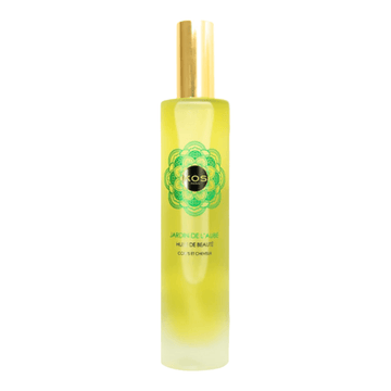 Kos Paris Dawn Garden Oil in a sleek frosted glass bottle with gold cap, infused with green tea and floral fragrance for body treatment.