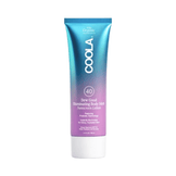 Coola Dew Good Illuminating Body Melt Lotion SPF 40 in a gradient blue and purple tube, ideal for hydrating and glowing sun protection.