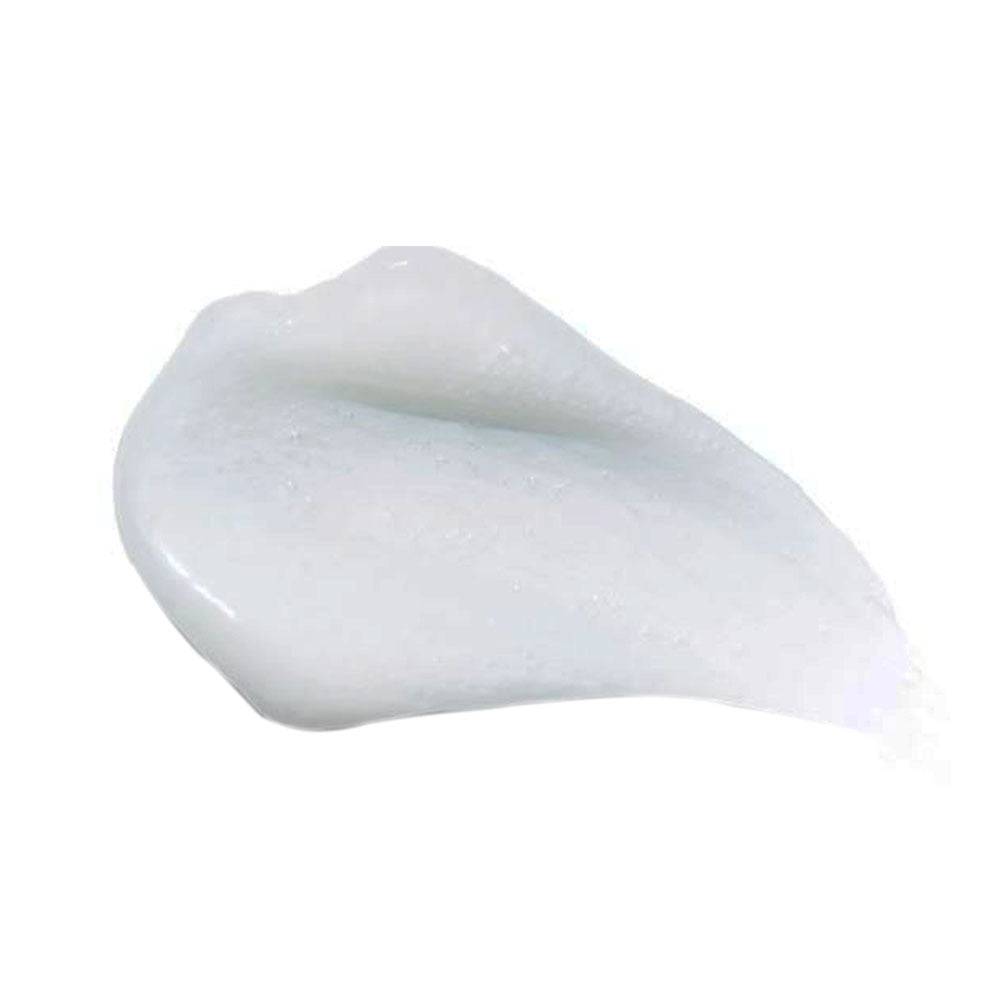 Close-up texture of HydroPeptide Exfoliating Cleanser showing creamy formula with exfoliating beads for radiant, smooth skin.