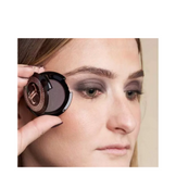 T LeClerc Eye Shadow 2.5g in bronze shown on fingertip, demonstrating its rich metallic pigmentation.