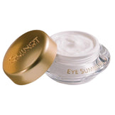 Guinot Eye Summum Balm anti-aging eye cream in a clear jar with gold lid, designed to reduce fine lines and signs of fatigue around the eyes.