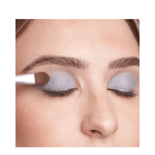 Close-up of T LeClerc Eye Shadow 2.5g in blue being applied with a brush, showcasing its buildable coverage.