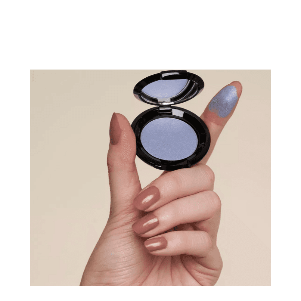 T LeClerc Eye Shadow 2.5g in plum shown on fingertip, demonstrating its rich pigmentation and smooth texture.