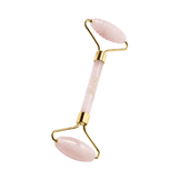 Payot Facial Quartz Roller features smooth and textured pink quartz heads with gold accents. Enhances skincare absorption and soothes facial muscles.