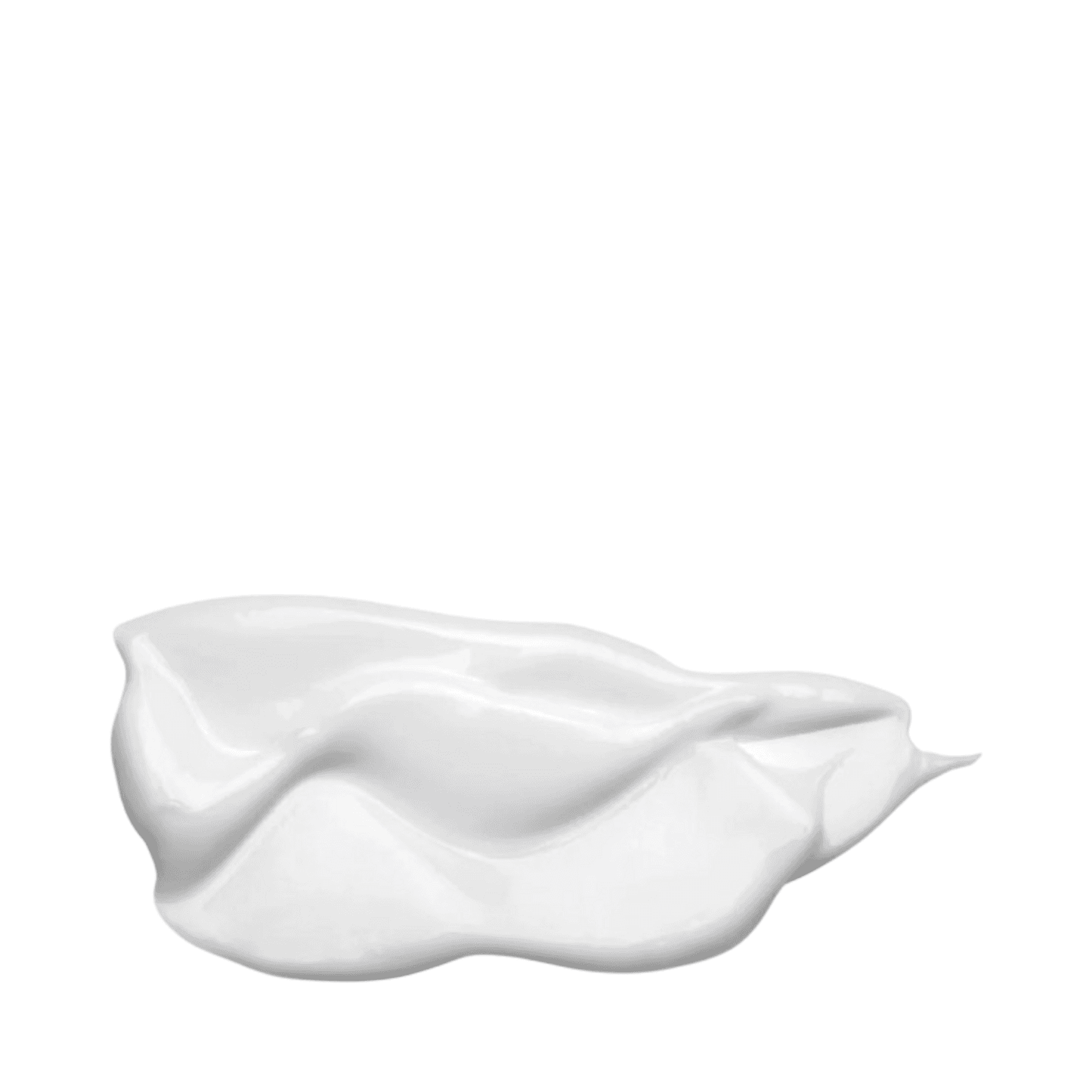 Close-up of Embryolisse Filaderme Emulsion's creamy white texture, showcasing its rich, nourishing formula for dry skin hydration.