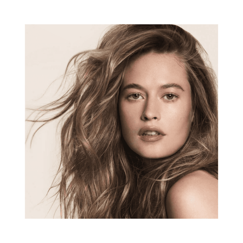 Model with voluminous, textured hair styled using Full Dry Volume Spray. Achieve a lived-in, full-bodied look with this hair treatment.